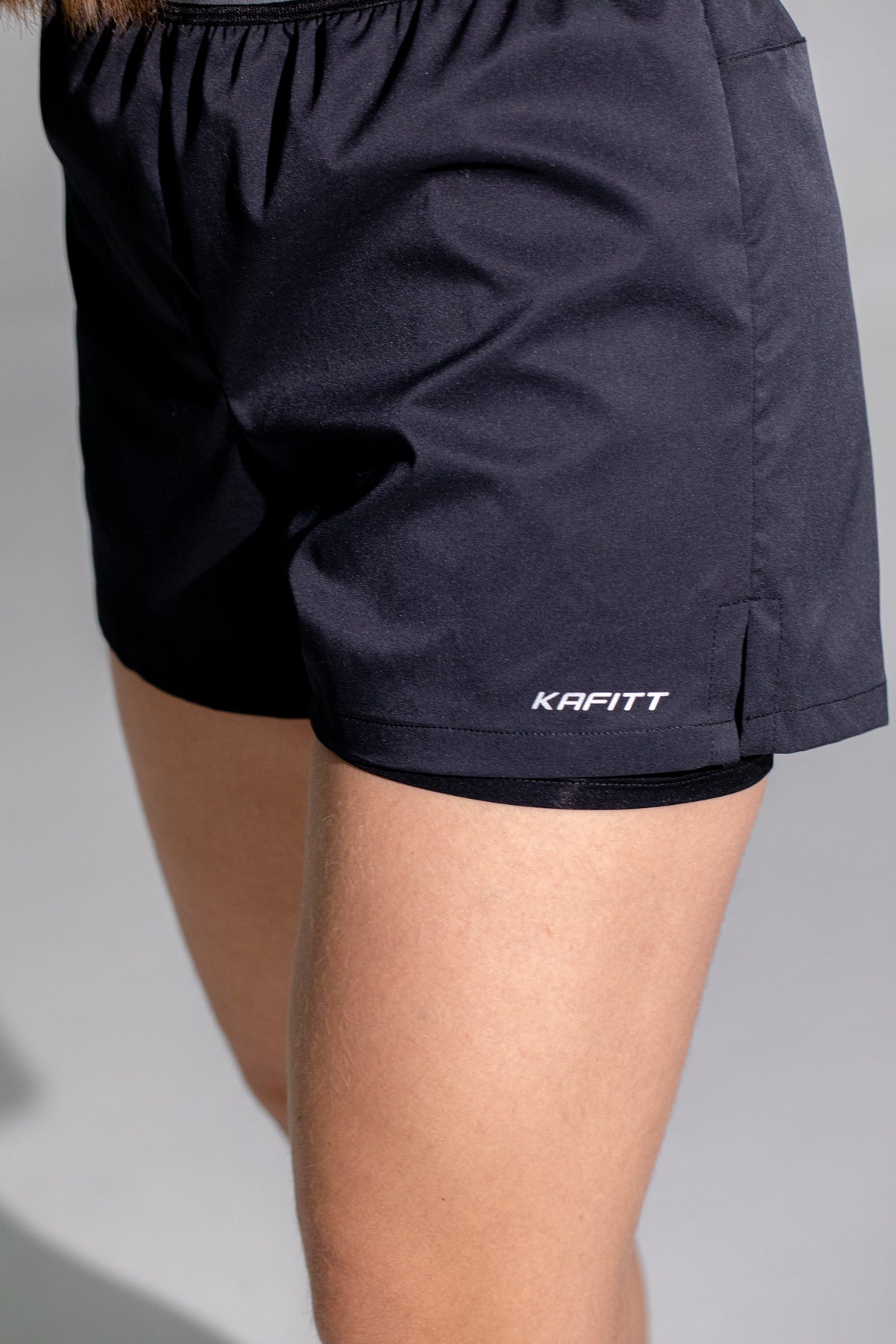PANTALONETA DE RUNNING CON LICRA NEGRA MUJER